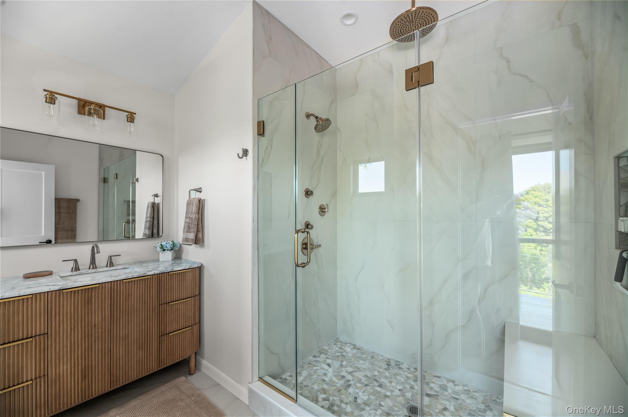 108 Ocean Road Ocean Beach, NY 11770 - Photo 13 of 23 Bathroom with a marble finish shower, vanity, and light tile patterned floors
