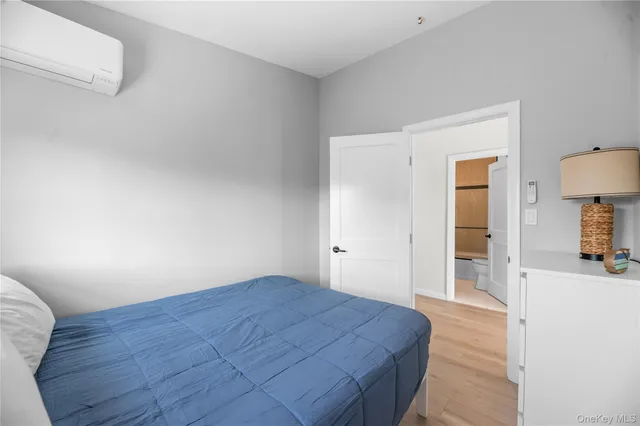 a bathroom with a double vanity sink mirror and shower