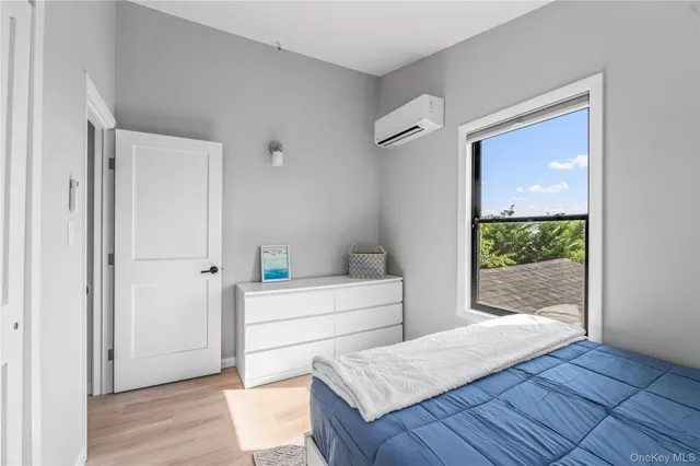 a bedroom with a bed and a lamp on table