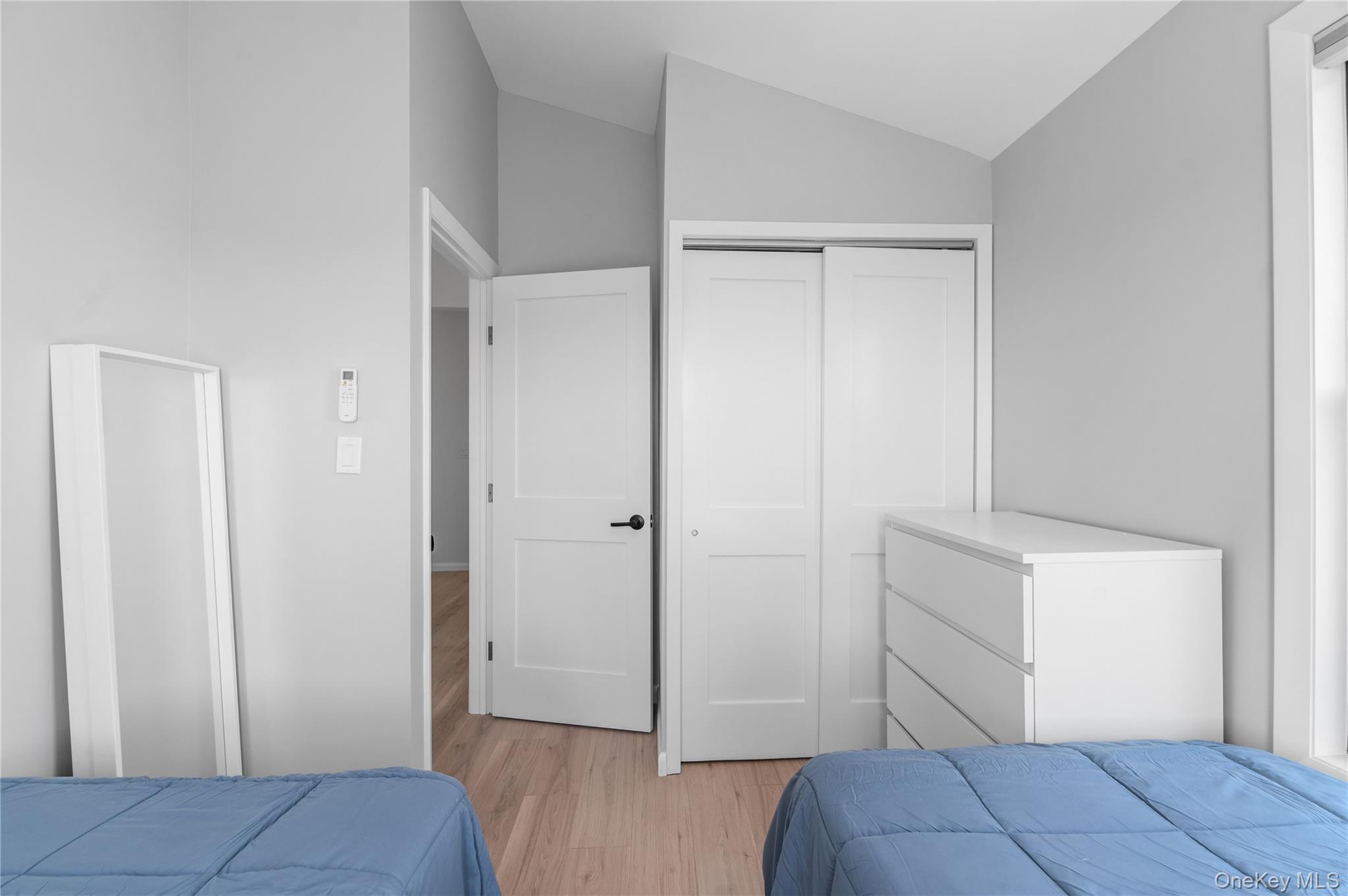 108 Ocean Road Ocean Beach, NY 11770 - Photo 19 of 23 Bedroom featuring light wood-type flooring, a closet, and lofted ceiling