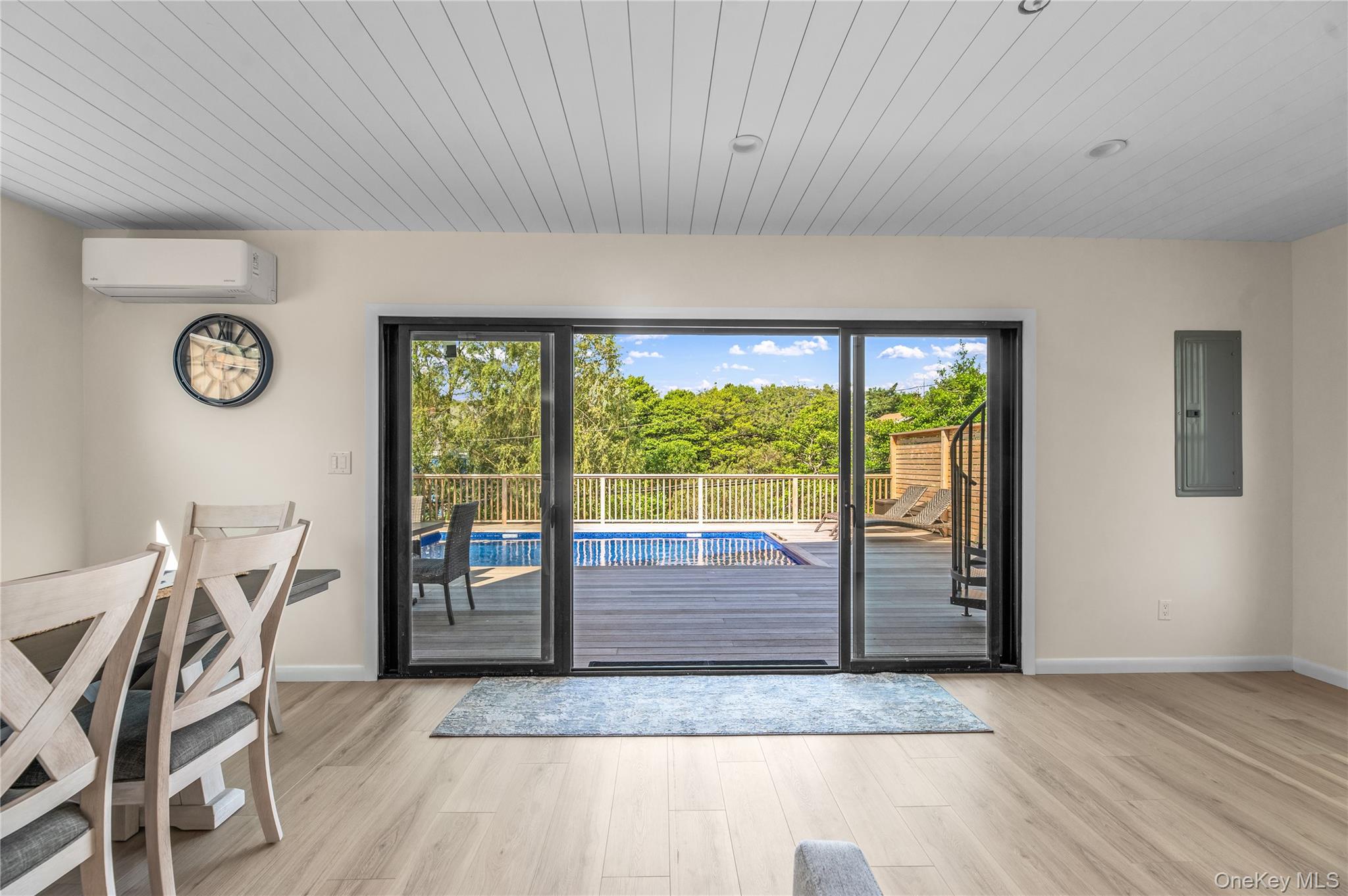 108 Ocean Road Ocean Beach, NY 11770 - Photo 21 of 23 Entryway featuring wood finished floors, electric panel, an AC wall unit, and wooden ceiling
