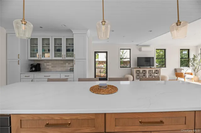 a bathroom with a shower and a sink