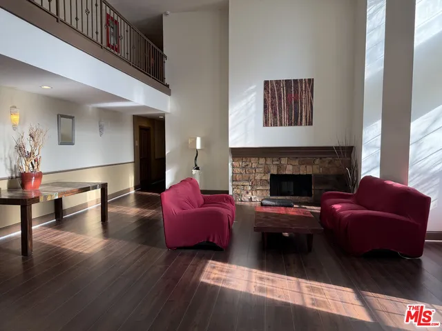 a living room with furniture fireplace and window