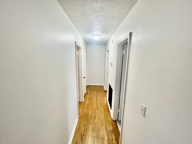 a view of entryway with wooden floor