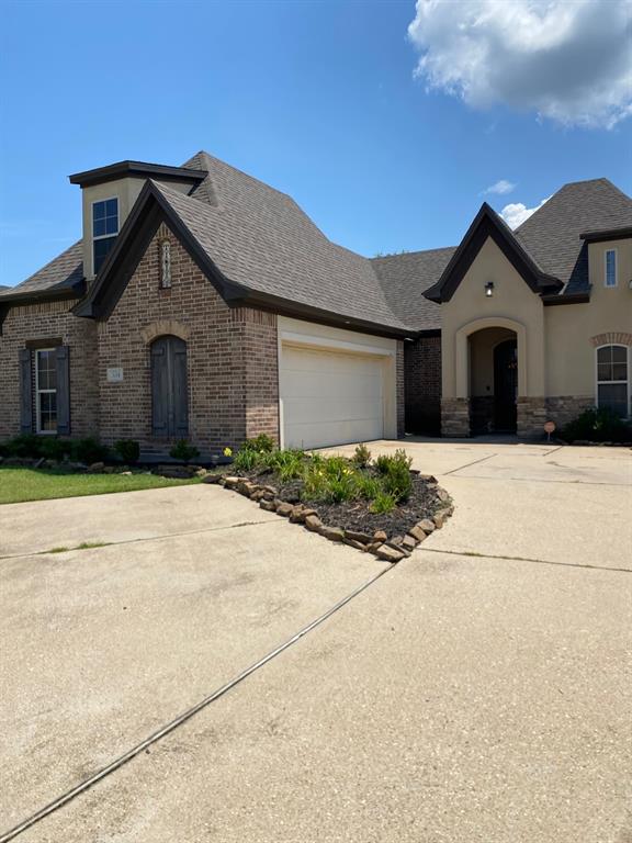 334 Wood Springs Haughton, LA 71037 - Photo 24 of 25 a front view of a house with a yard and garage