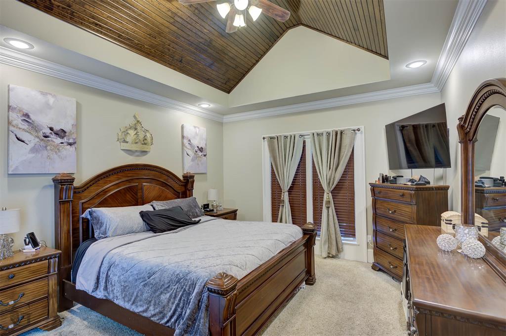 334 Wood Springs Haughton, LA 71037 - Photo 9 of 25 a bedroom with a bed a television and dresser