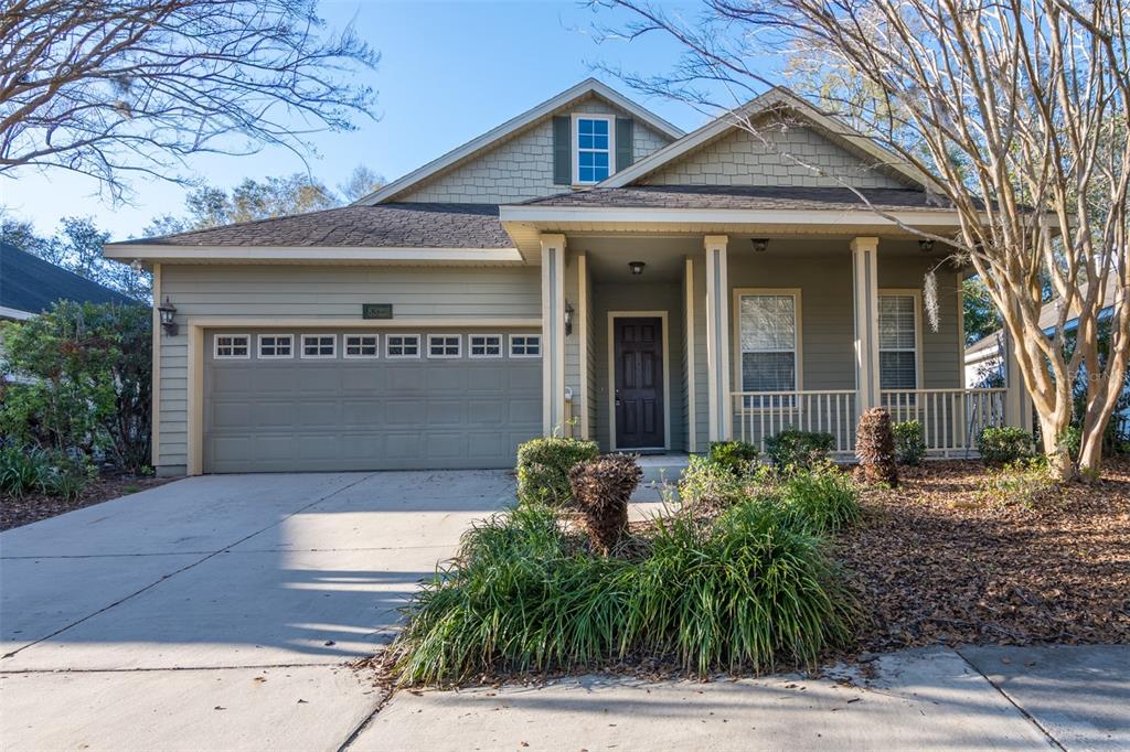 8322 Southwest 77th Avenue Gainesville, FL 32608 - Photo 1 of 1 a front view of a house with garden