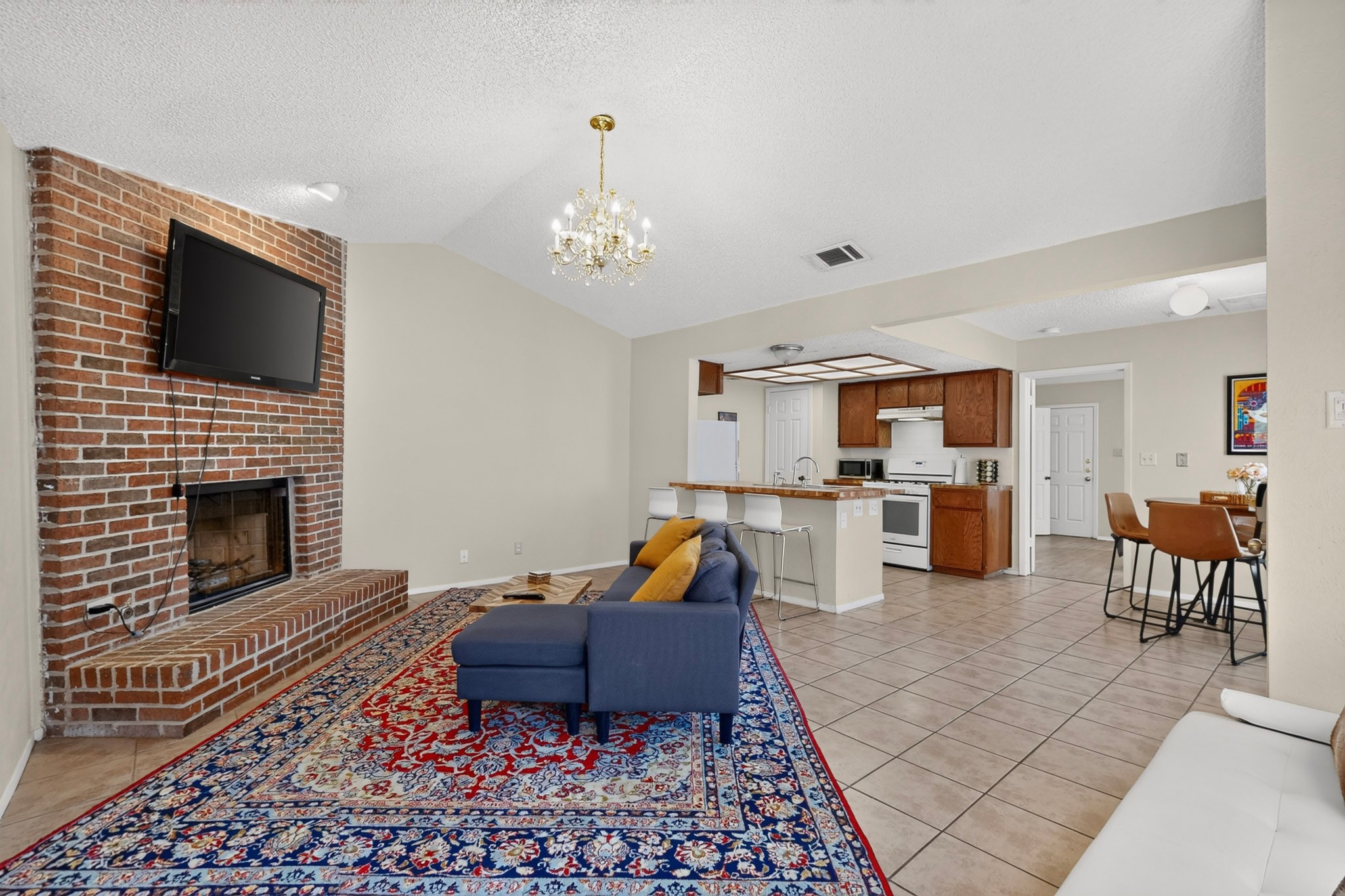 1602 Waterloo Trail, Unit B Austin, TX 78704 - Photo 31 of 31 An open floorplan seamlessly connects the fireside living room to the adjacent kitchen space.