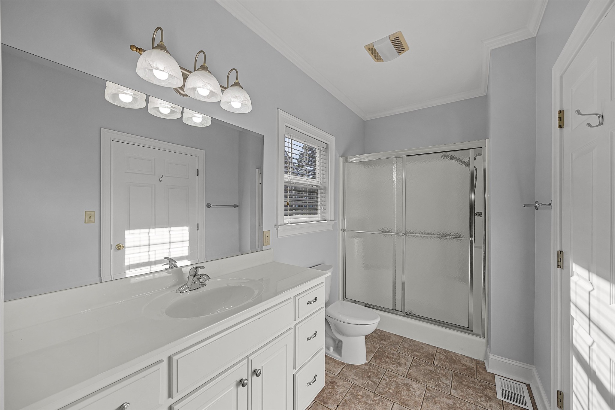 6 Laura Lane Iuka, MS 38852 - Photo 13 of 25 a bathroom with a toilet sink and mirror
