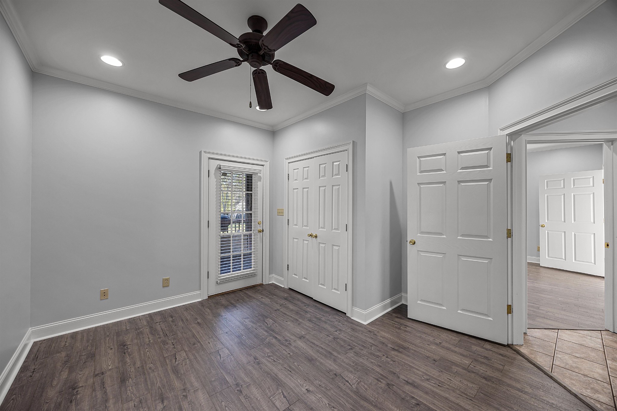 6 Laura Lane Iuka, MS 38852 - Photo 14 of 25 a view of an empty room with a window and wooden floor
