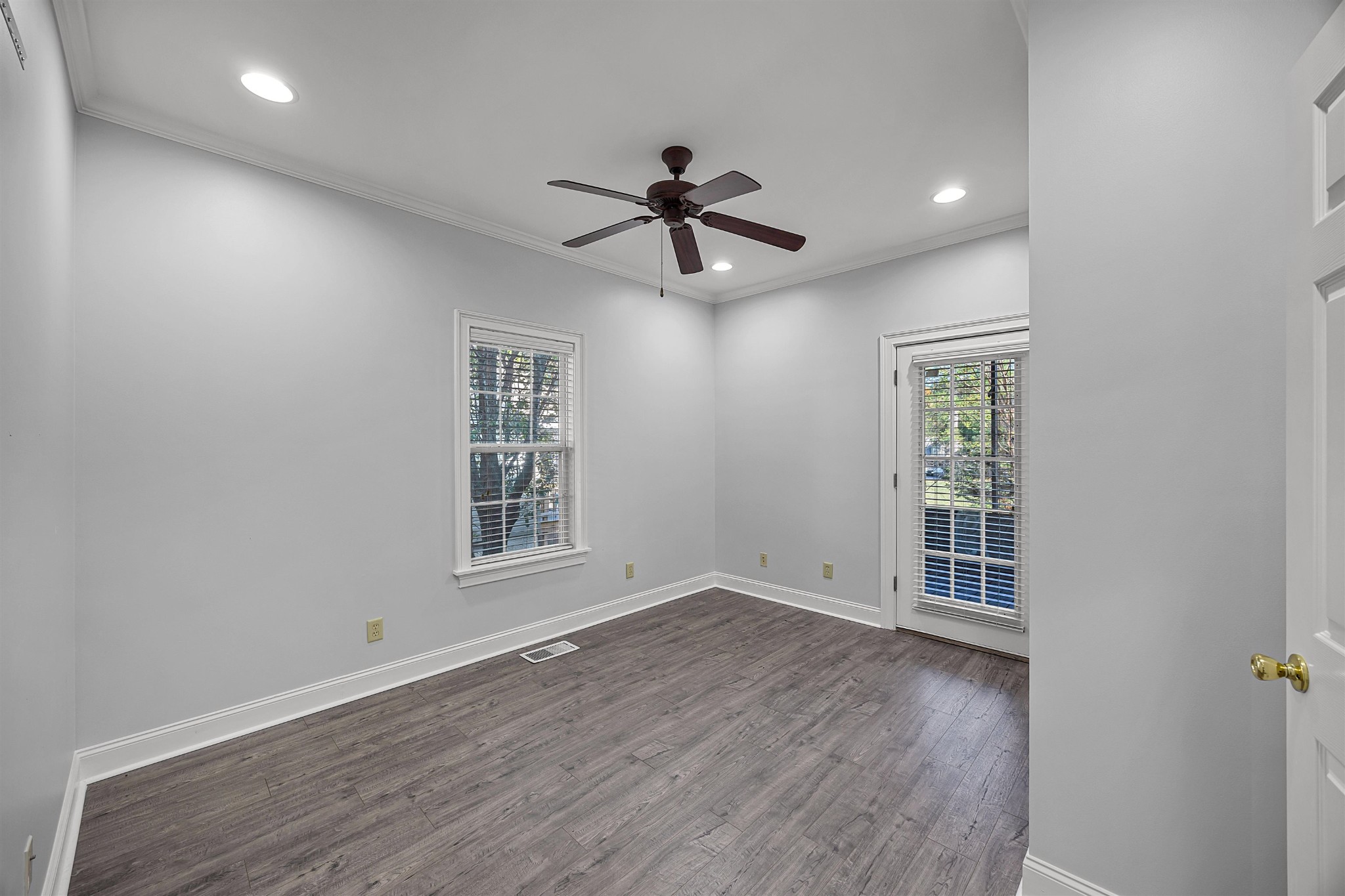 6 Laura Lane Iuka, MS 38852 - Photo 15 of 25 an empty room with wooden floor ceiling fan and windows