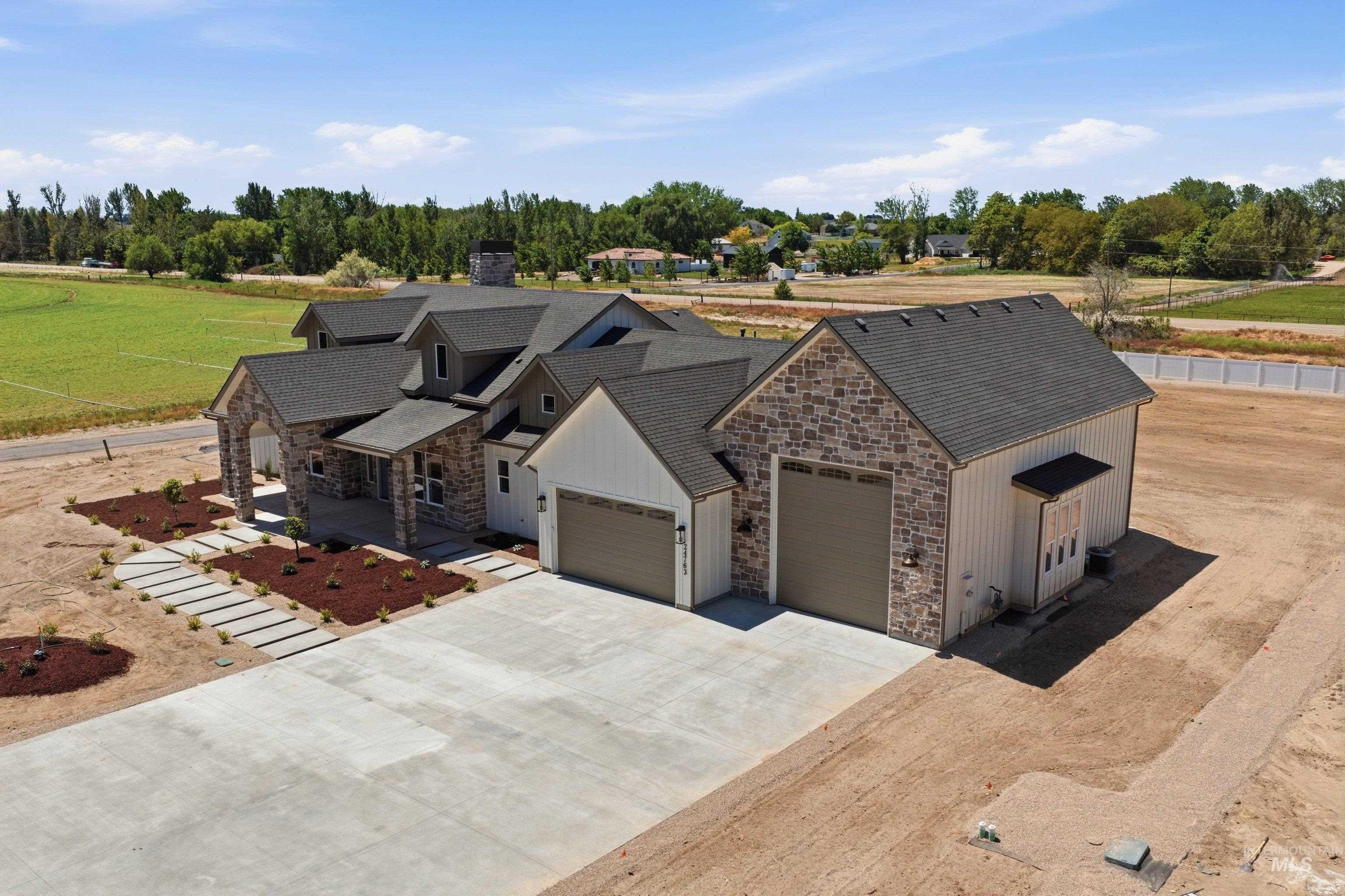 24763 Ardmore Court Caldwell, ID 83607 - Photo 41 of 50 Contemporary ranch-style residence featuring a stone and board-and-batten exterior