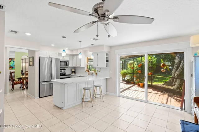 a kitchen with a refrigerator and countertop