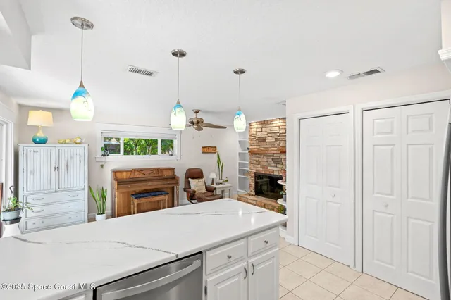 a living room with furniture a fireplace and a table
