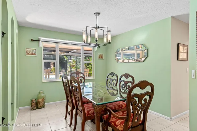 a bedroom with a bed a couch and a window