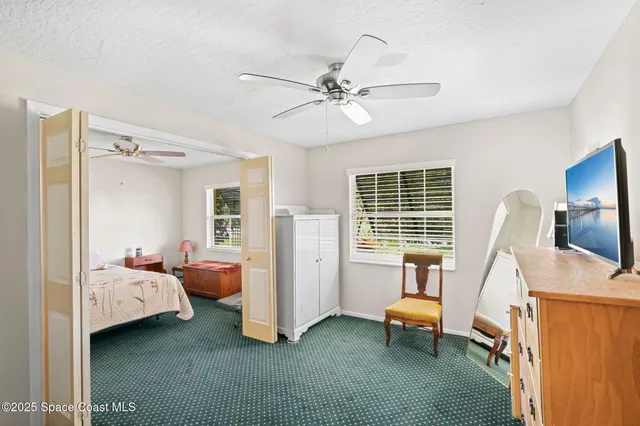 a view of a swimming pool with a porch
