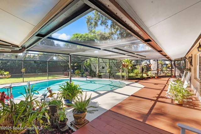 a view of a house with backyard porch and sitting area