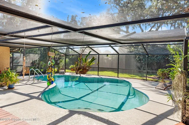 a potted plant sitting in front of a house