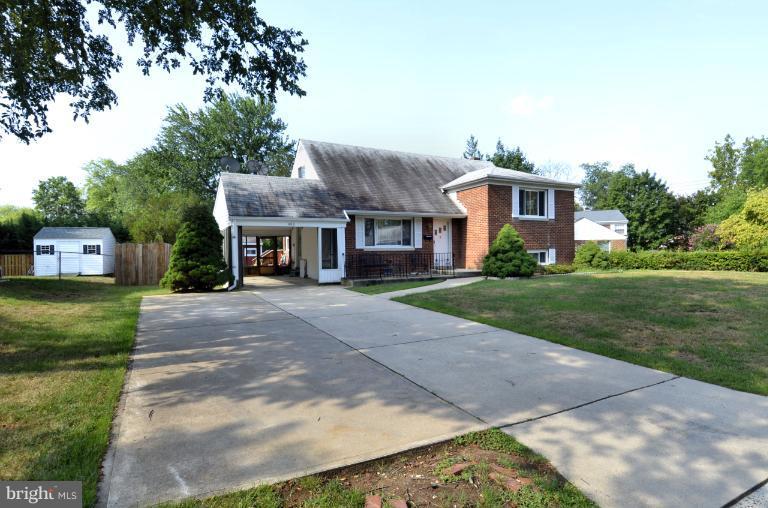 6911 Gilbert Street Springfield, VA 22150 - Photo 5 of 30 a front view of a house with a yard