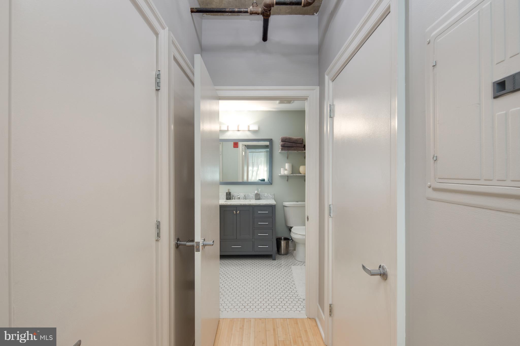 1300 N Street Northwest, Unit 4 Washington, DC 20005 - Photo 11 of 19 a bathroom with a sink and mirror