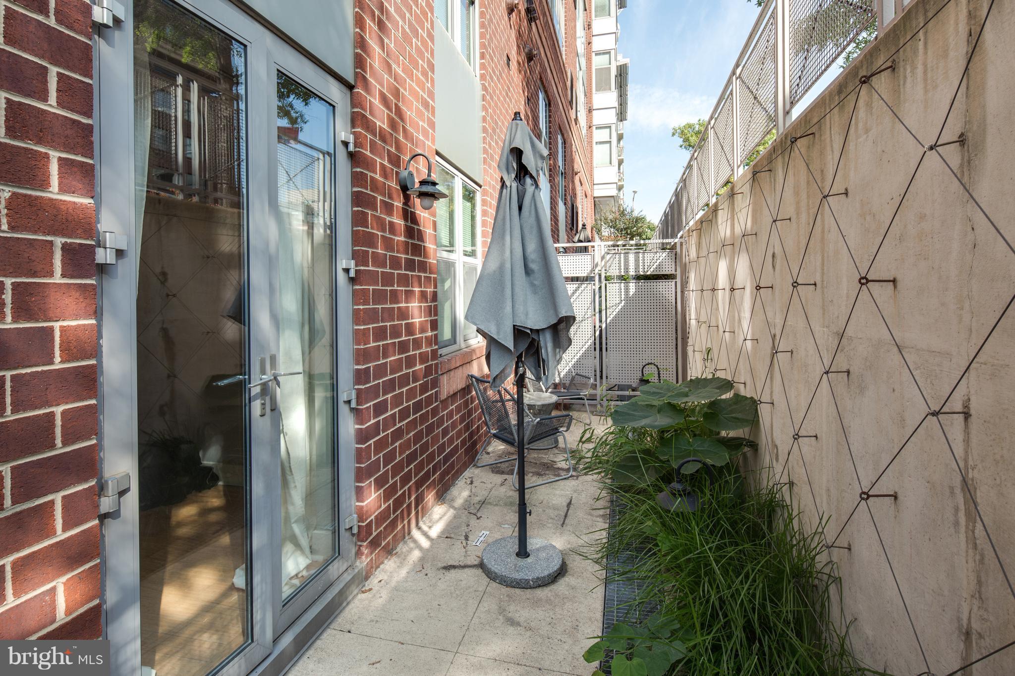 1300 N Street Northwest, Unit 4 Washington, DC 20005 - Photo 14 of 19 a view of path along with brick building