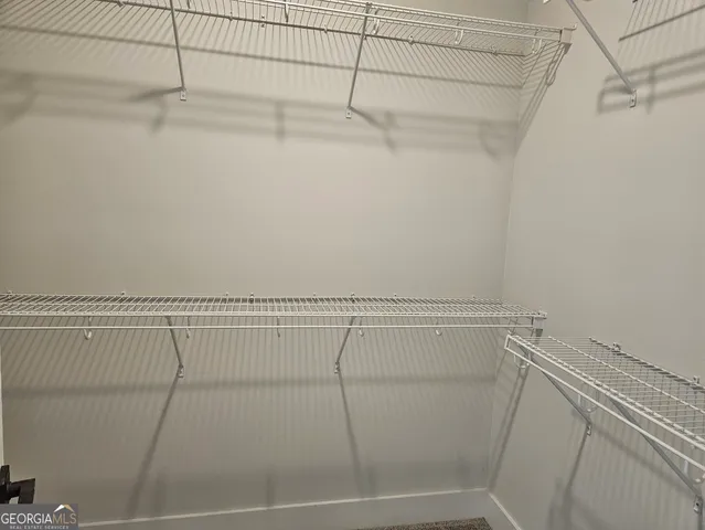 a view of a room with racks on the wall