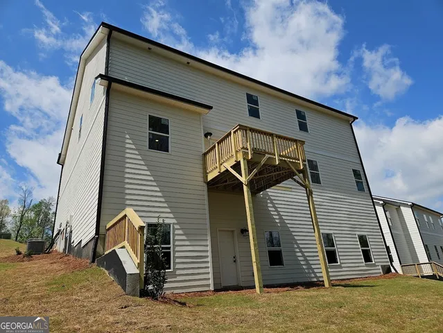 a front view of a house with stairs