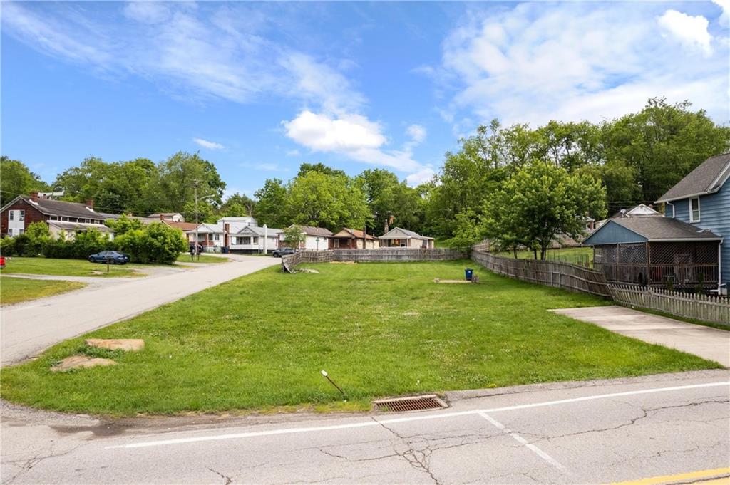 a view of a swimming pool with a yard