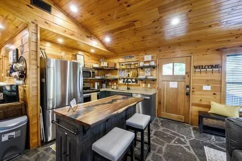 a kitchen with stainless steel appliances granite countertop lots of counter top space