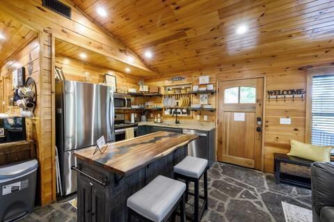 209 Pinyon Road Broken Bow, OK 74728 - Photo 13 of 31 a kitchen with refrigerator and chairs