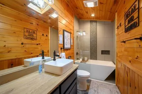 a bathroom with a bathtub and shower