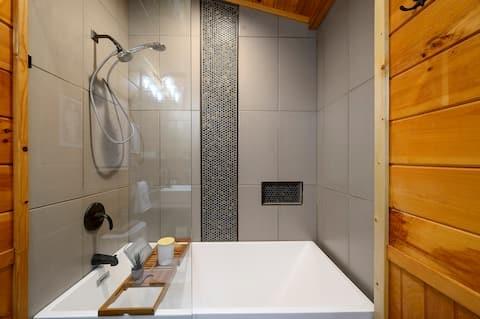 209 Pinyon Road Broken Bow, OK 74728 - Photo 23 of 31 a bathroom with a bathtub and shower