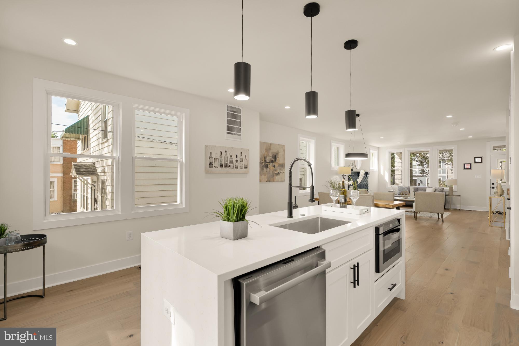 5331 42nd Street Northwest Washington, DC 20015 - Photo 16 of 51 a kitchen with stainless steel appliances granite countertop a sink a window and chairs