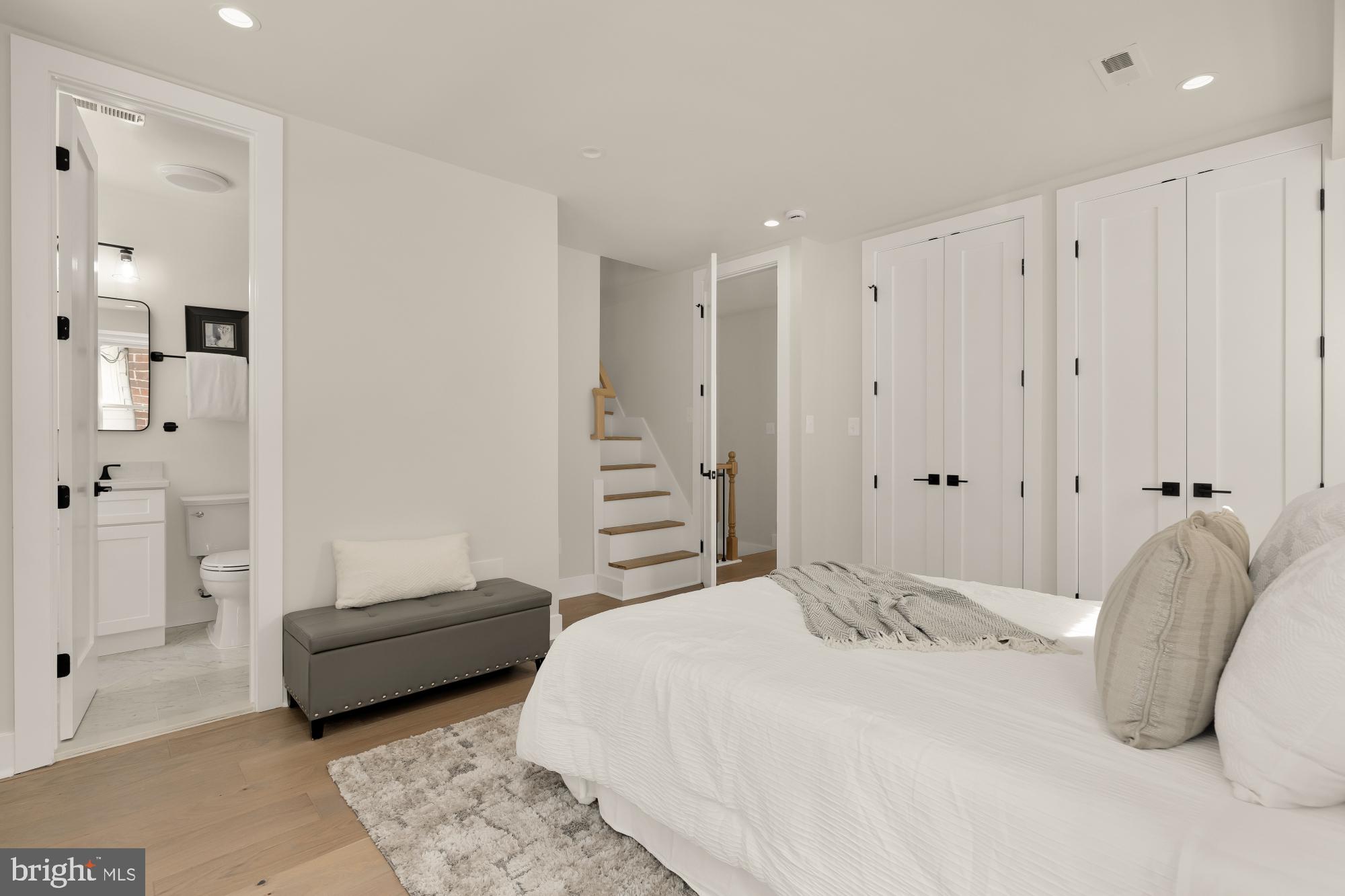 5331 42nd Street Northwest Washington, DC 20015 - Photo 29 of 51 a bedroom with a bed and a couch