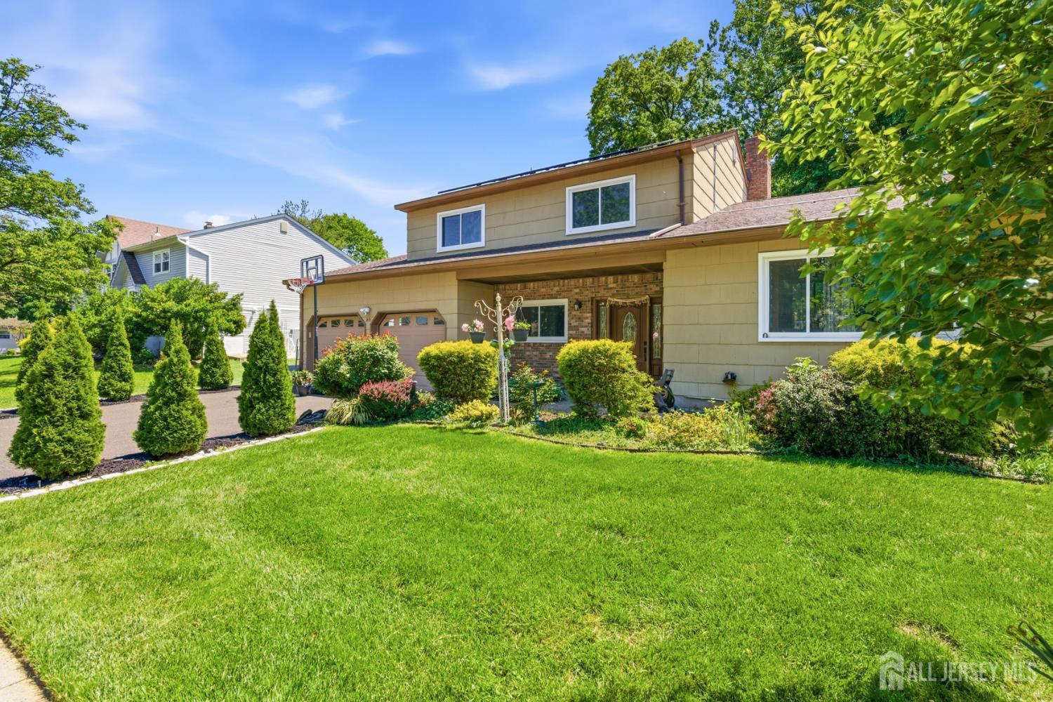 213 Normandy Road Edison, NJ 08820 - Photo 3 of 45 a front view of a house with garden