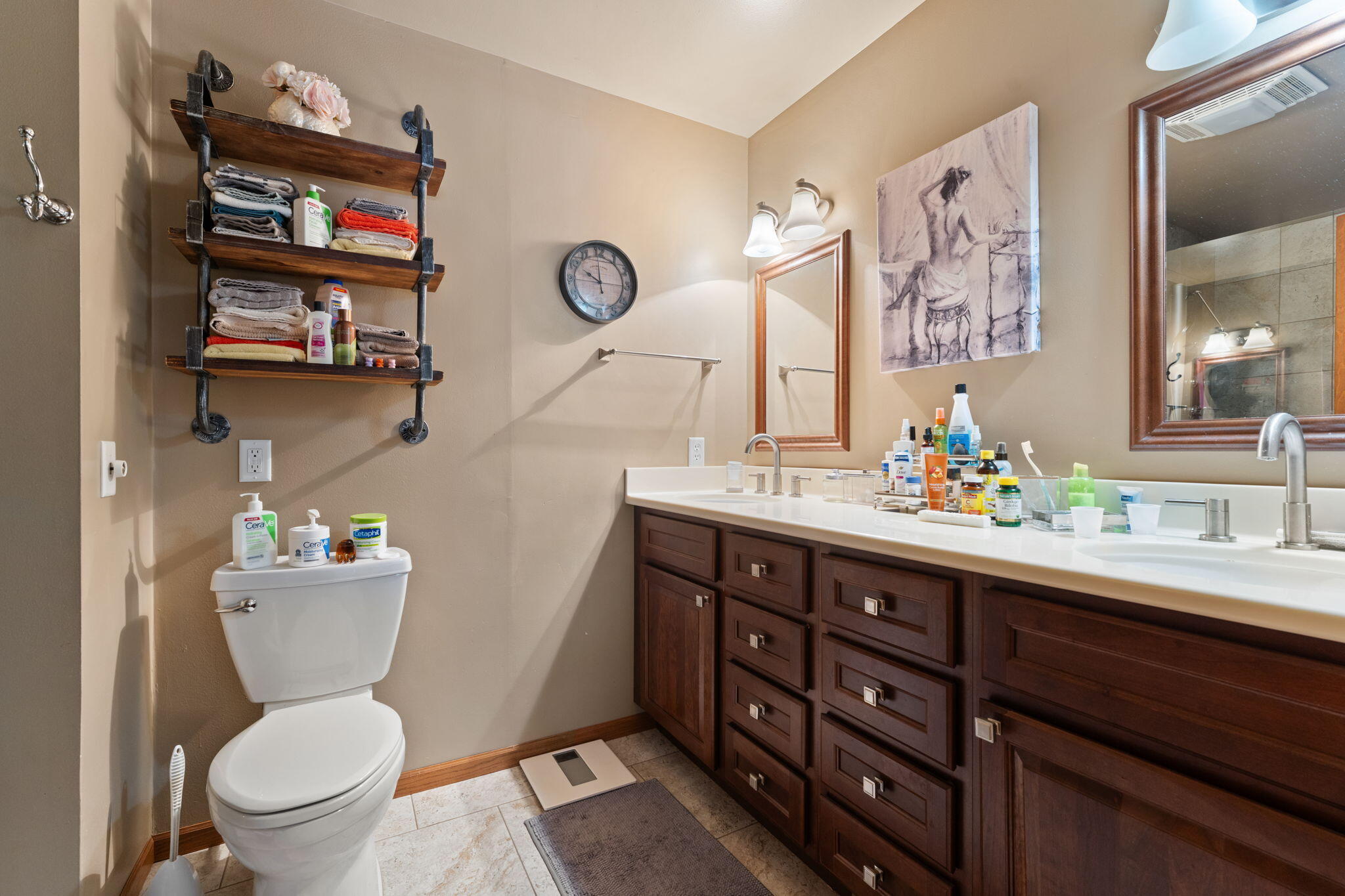 507 South 20th Street Chesterton, IN 46304 - Photo 16 of 27 a bathroom with a toilet a sink and a mirror