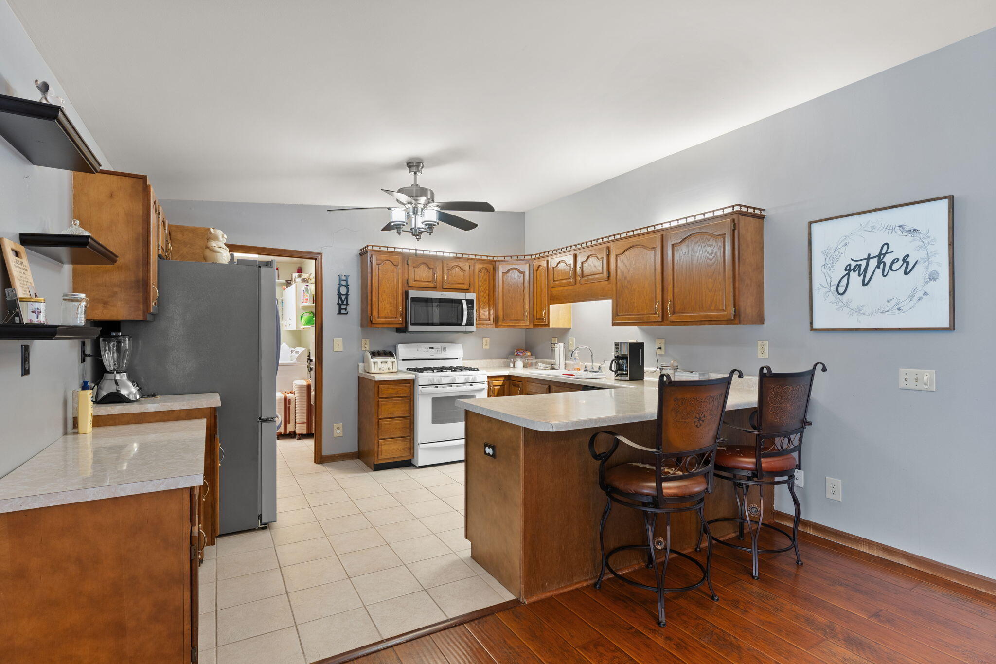 507 South 20th Street Chesterton, IN 46304 - Photo 8 of 27 a kitchen with stainless steel appliances kitchen island granite countertop a sink and cabinets