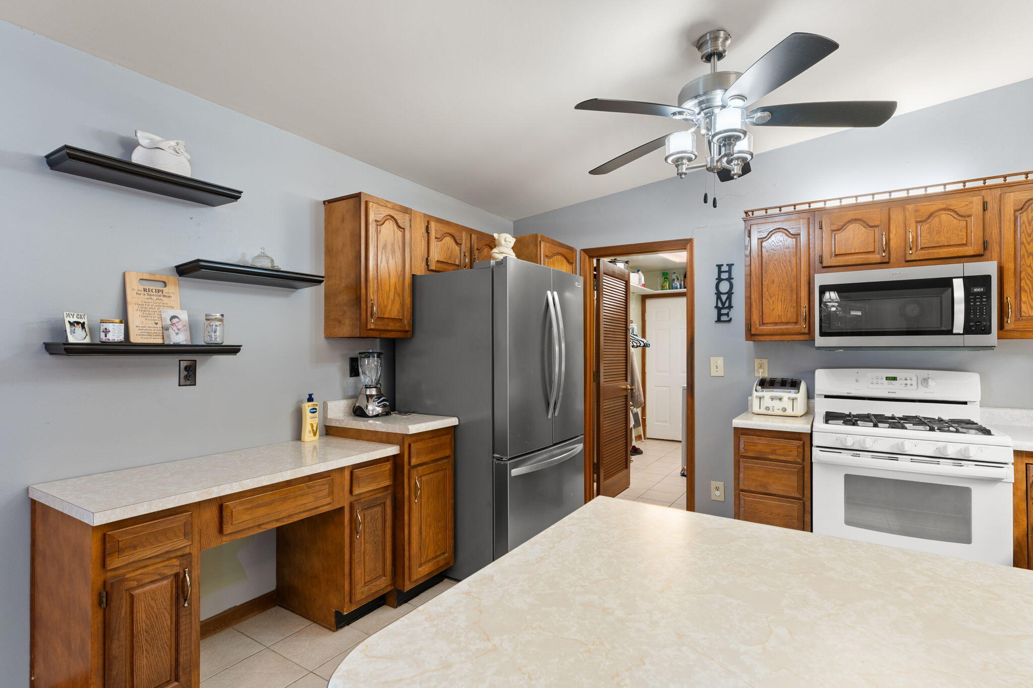 507 South 20th Street Chesterton, IN 46304 - Photo 9 of 27 a kitchen with stainless steel appliances a stove refrigerator and microwave