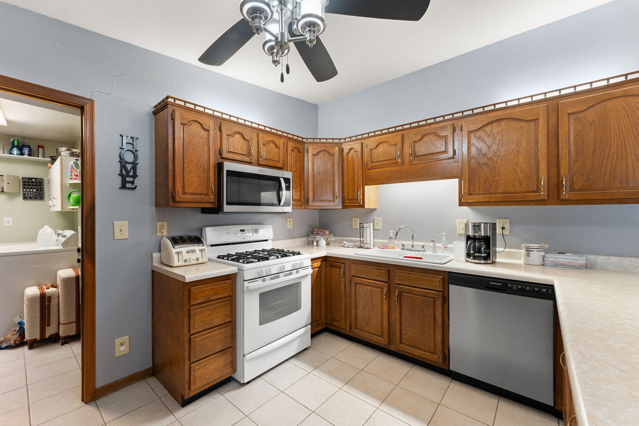 507 South 20th Street Chesterton, IN 46304 - Photo 10 of 27 a kitchen with stainless steel appliances a sink stove and microwave