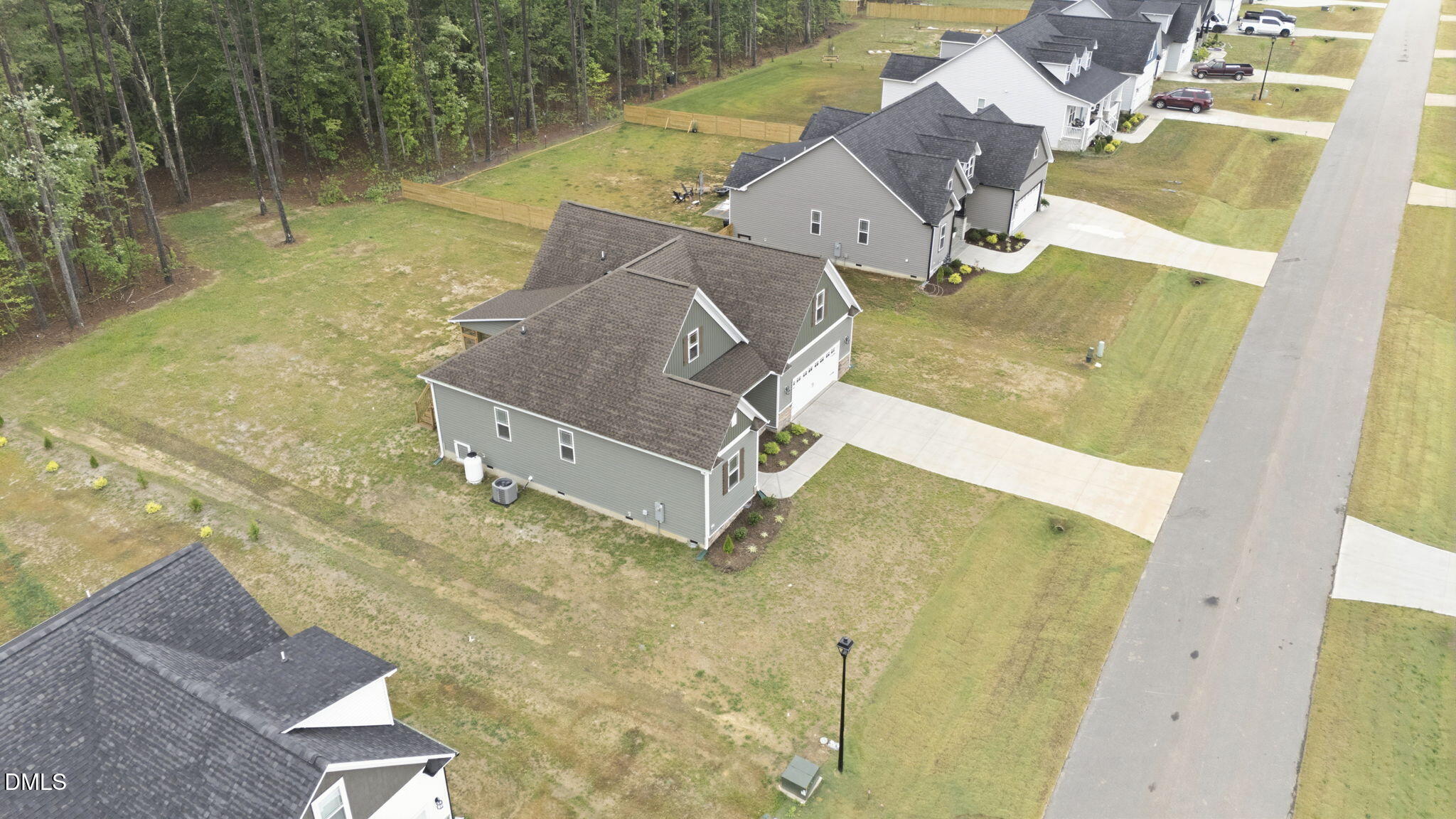146 Seahawk Way Zebulon, NC 27597 - Photo 48 of 51 an aerial view of residential house with pool and trees