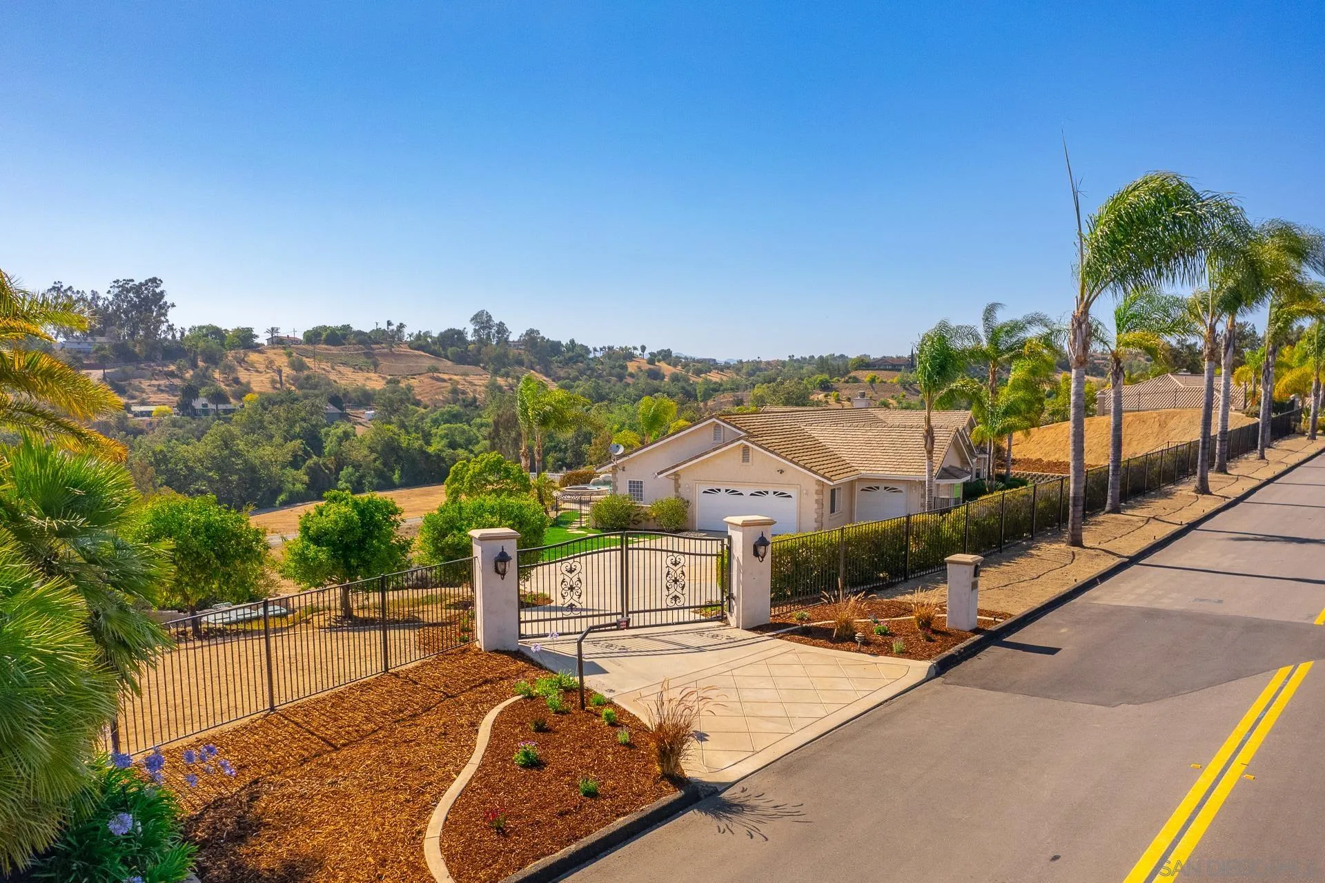 4445 Fallsbrae Road Fallbrook, CA 92028 - Photo 34 of 41 a view of a house with a swimming pool