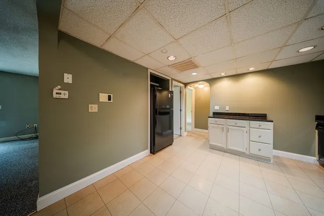 a large kitchen with cabinets and stainless steel appliances