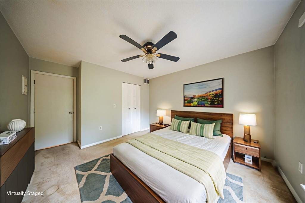 3 Shadowbrook Lane, Unit 3 Milford, MA 01757 - Photo 14 of 35 a bedroom with a bed and a chandelier