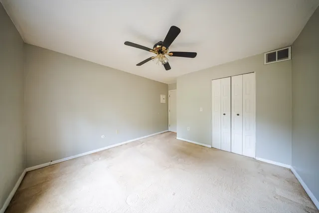 a bedroom with a bed and dresser