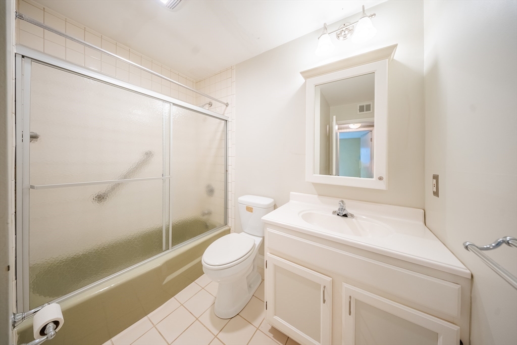 3 Shadowbrook Lane, Unit 3 Milford, MA 01757 - Photo 19 of 35 a bathroom with a sink a toilet and shower