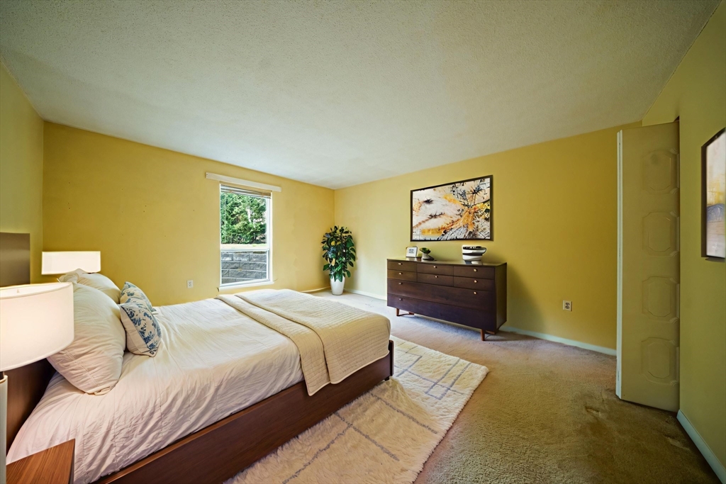 3 Shadowbrook Lane, Unit 3 Milford, MA 01757 - Photo 20 of 35 a bedroom with a bed and dresser