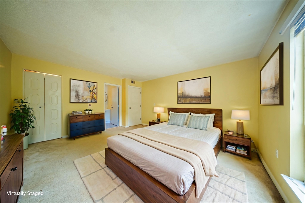3 Shadowbrook Lane, Unit 3 Milford, MA 01757 - Photo 23 of 35 a spacious bedroom with a bed and a view of bathroom