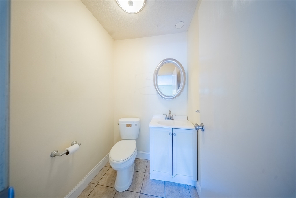 3 Shadowbrook Lane, Unit 3 Milford, MA 01757 - Photo 26 of 35 a bathroom with a toilet and a sink