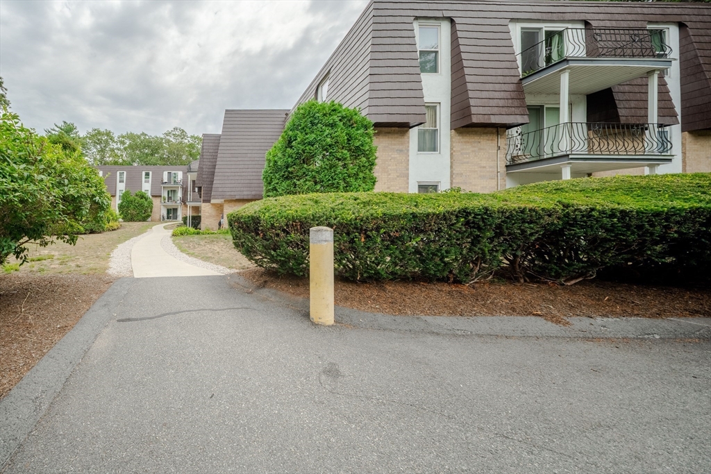 3 Shadowbrook Lane, Unit 3 Milford, MA 01757 - Photo 31 of 35 front view of a house with a yard