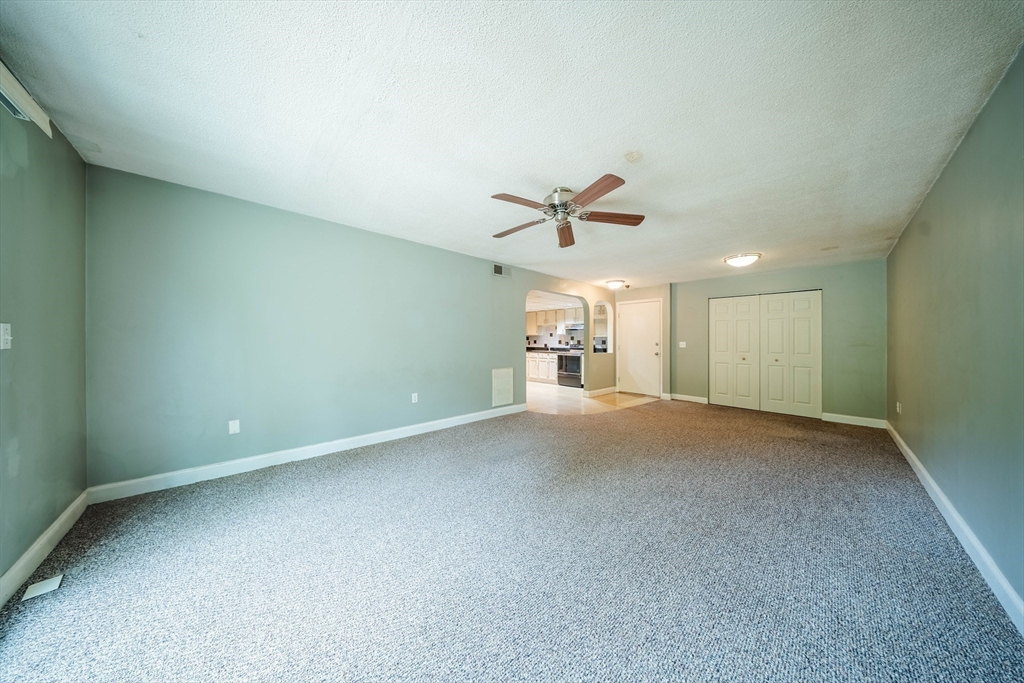 3 Shadowbrook Lane, Unit 3 Milford, MA 01757 - Photo 7 of 35 a view of a livingroom with a ceiling fan and window